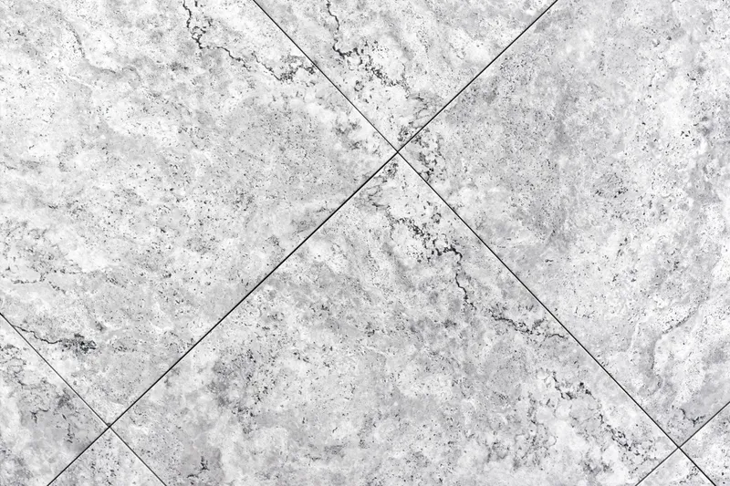 Gạch vân đá Granite (Porcelain) màu xám trắng với họa tiết đá tự nhiên chân thực, bề mặt hiện đại sang trọng, độ bền cao, phù hợp lát nền và ốp tường nhiều không gian.