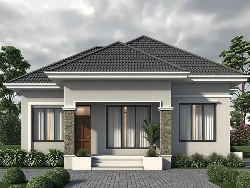 Thiết kế nhà cấp 4 mái Nhật tối giản với tông màu ghi xám thanh lịch, kết hợp hệ cột ốp đá tự nhiên tạo điểm nhấn kiên cố và sang trọng.