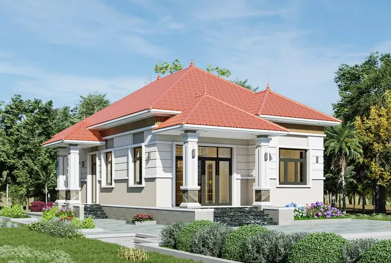 Mẫu nhà cấp 4 mái Nhật ngói đỏ tươi, tường phối màu trắng kem và nâu nhạt, bậc tam cấp đá đen vân mây cùng khuôn viên sân vườn nhiều cây xanh.