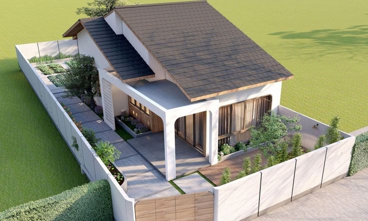 Mẫu nhà cấp 4 mái lệch hiện đại có sân vườn tiểu cảnh, lối đi dạo lát đá bên hông nhà, tường rào trắng bao quanh và khu vườn rau nhỏ phía sau.