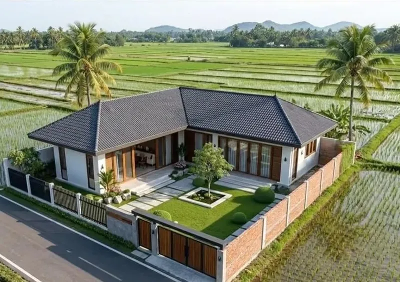Mẫu nhà cấp 4 chữ L mái Nhật hiện đại có sân vườn, thảm cỏ xanh mướt, bao quanh bởi cánh đồng, hệ cửa kính khung gỗ sang trọng mở ra khoảng hiên thoáng đãng.
