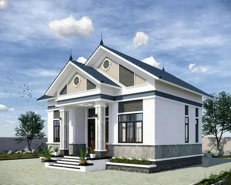 Mẫu nhà cấp 4 mái Thái hiện đại màu trắng phối xám ghi, thiết kế giật cấp hai mặt tiền với hệ cột vuông và chân tường ốp đá sang trọng.