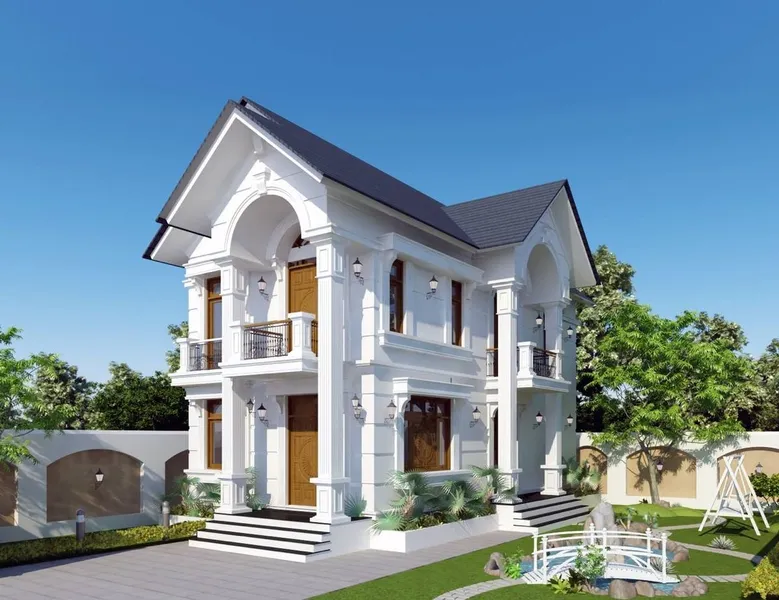 Mẫu biệt thự 2 tầng mái Thái tân cổ điển màu trắng tinh khôi, thiết kế hai mặt tiền sảnh vòm cong, cửa gỗ ấm cúng và sân vườn tiểu cảnh có hồ nước, cầu nhỏ.
