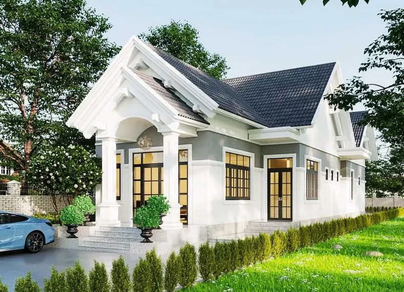 Mẫu nhà cấp 4 mái thái hiện đại sơn trắng phối xám ghi, sảnh chính thiết kế hệ cột trụ tròn đôi vững chãi và mái chữ A giật cấp nổi bật.
