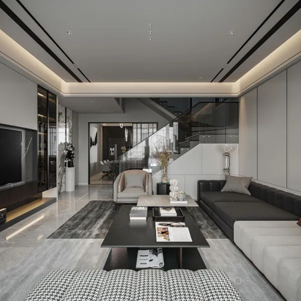 Phòng khách hiện đại với tông màu xám đen sang trọng, sofa dài, bàn trà đa tầng và thiết kế thông thoáng gần cầu thang kính.